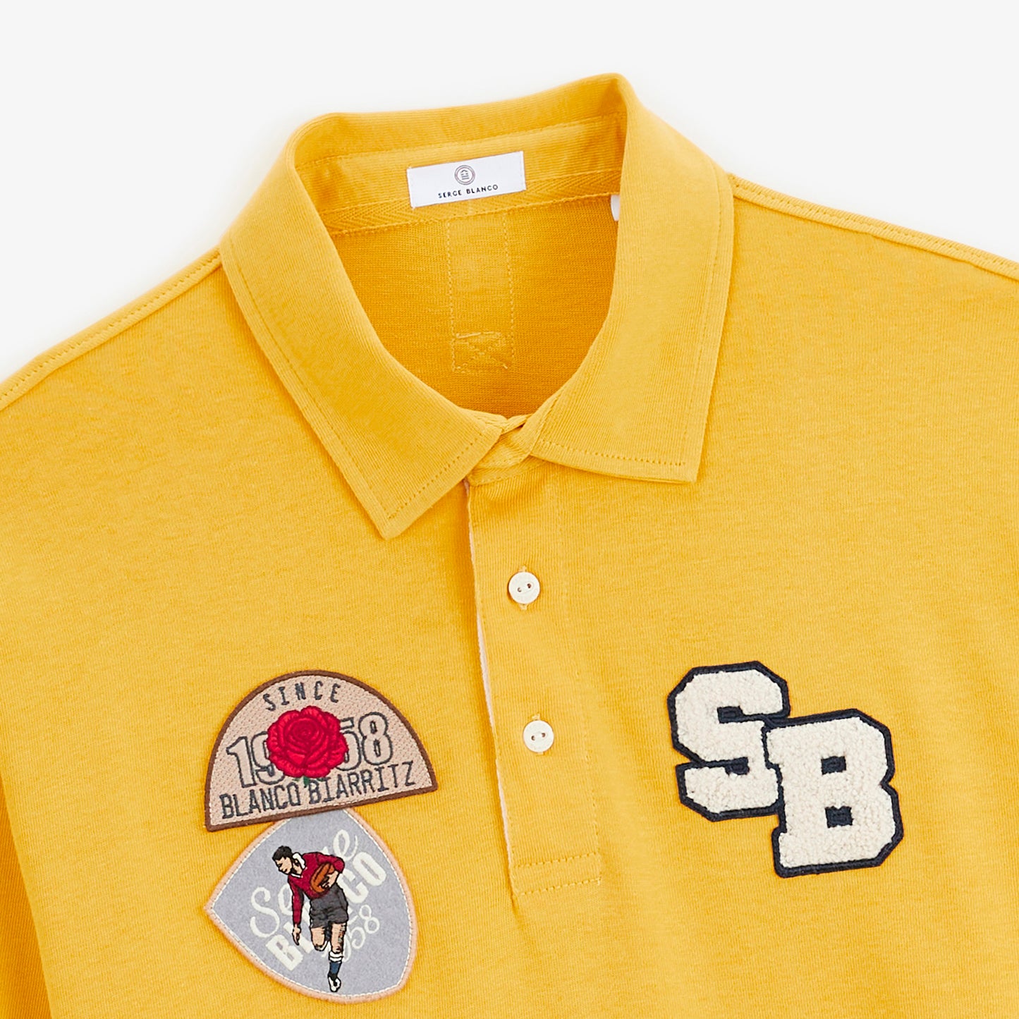Polo de rugby manches longues badges brodés jaune moutarde