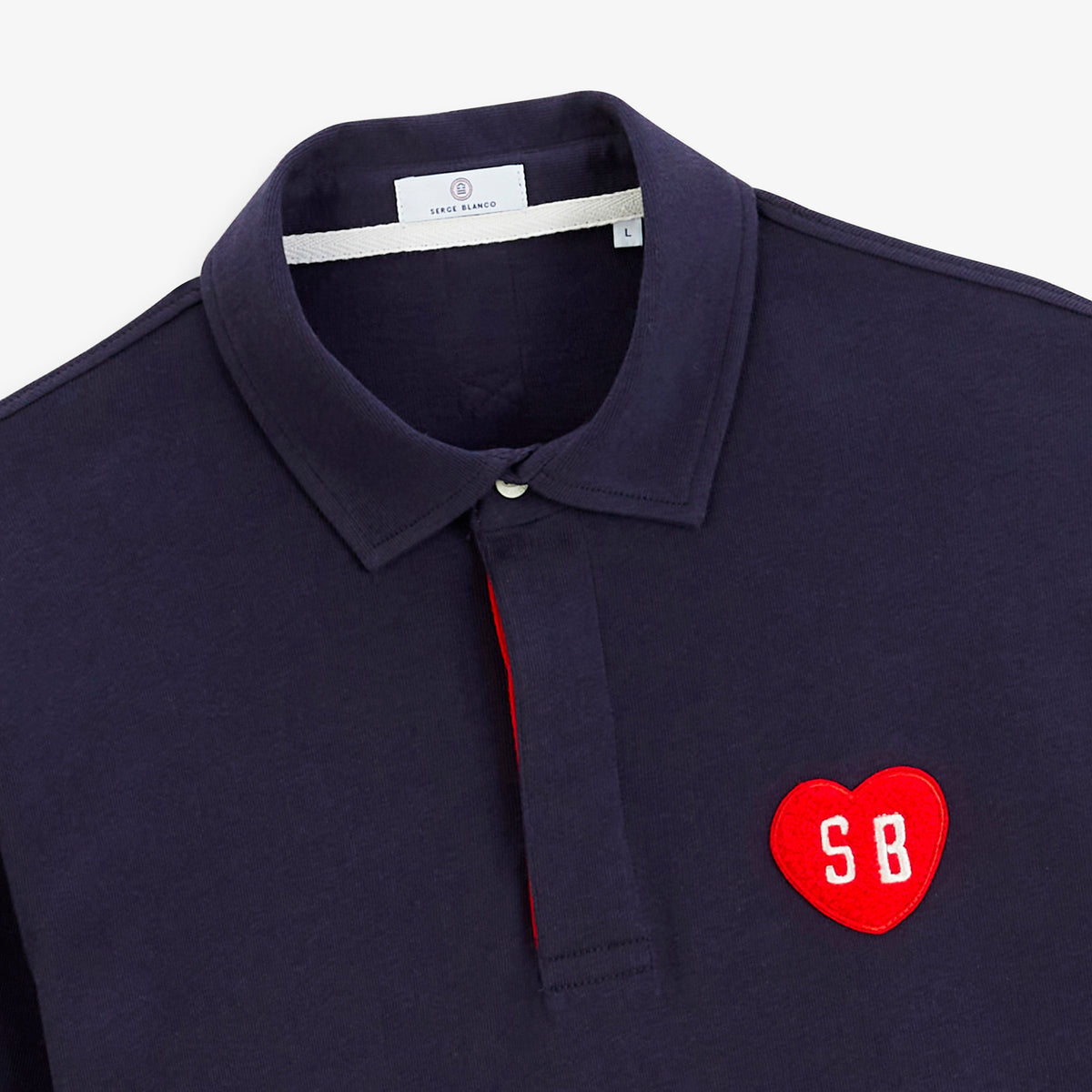 Polo de rugby manches longues badge cœur bouclette bleu marine