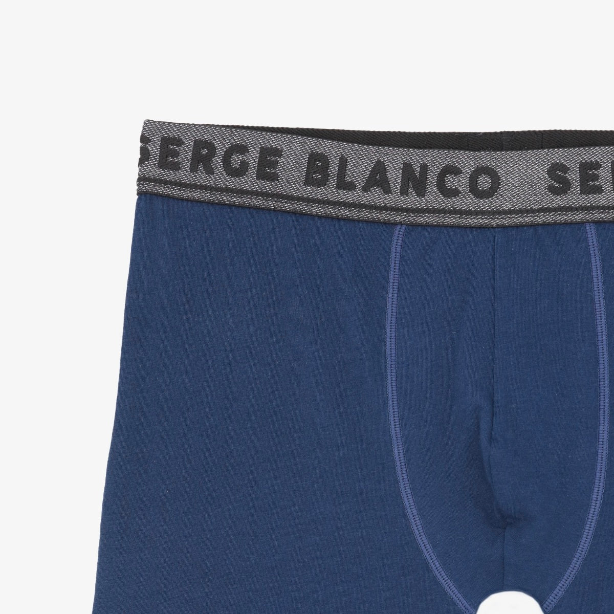 Détail du boxer bleu marine SERGE BLANCO et de sa ceinture élastiquée siglée.