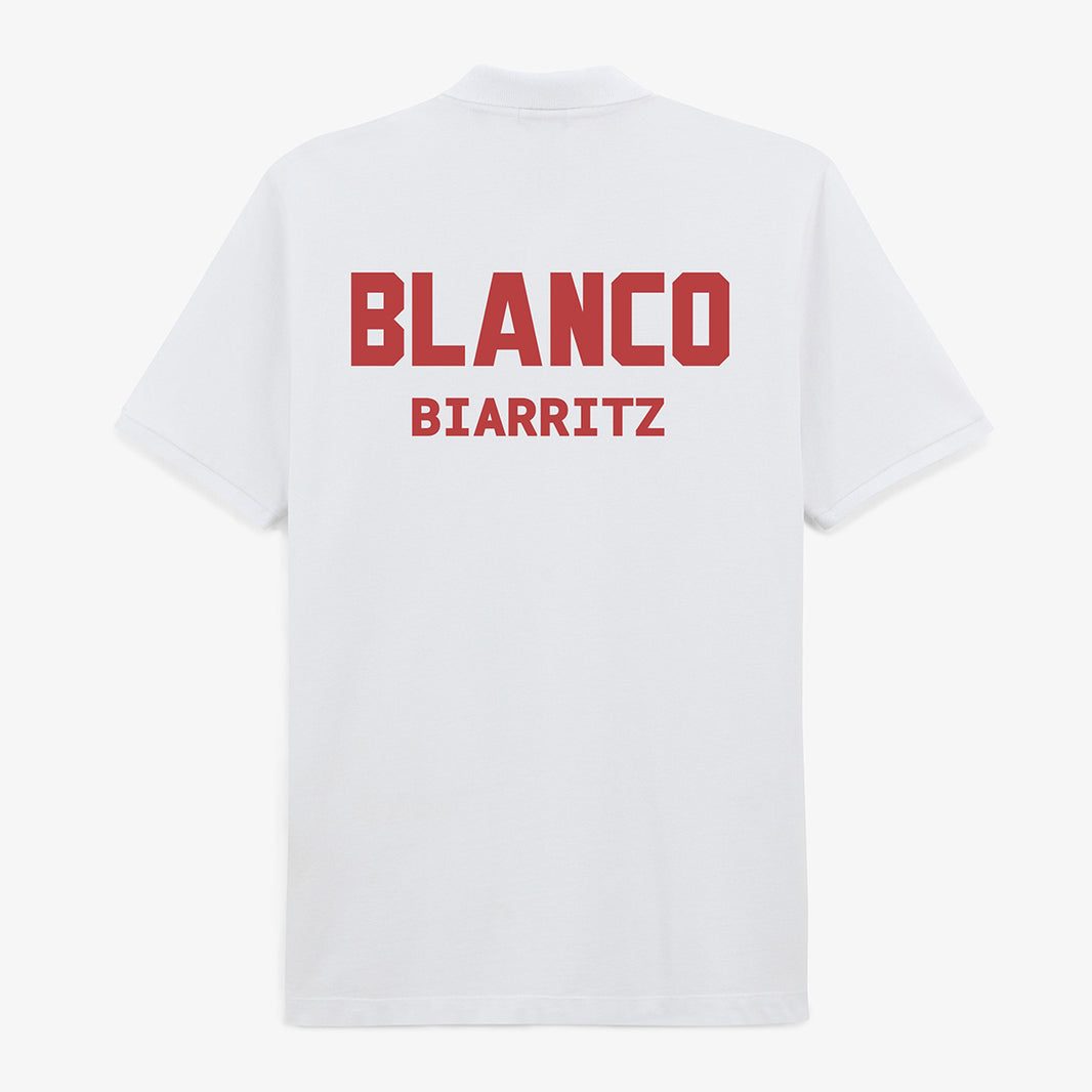 Léine Polo Gearrmhuinchille Cadáis Phíce Bán d'Fhir ó Serge Blanco