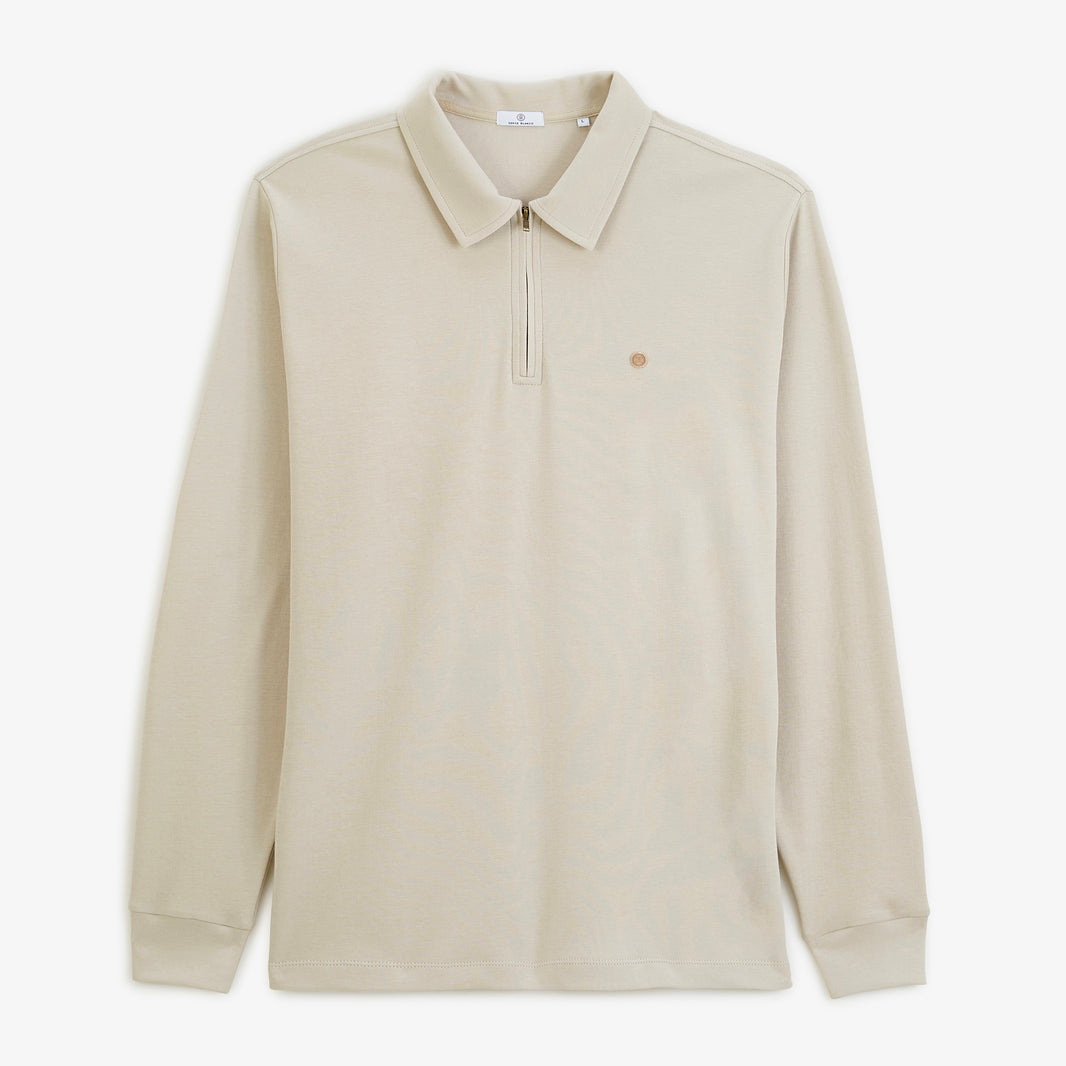 Polo zippé à manches longues en coton interlock beige, vue de face.