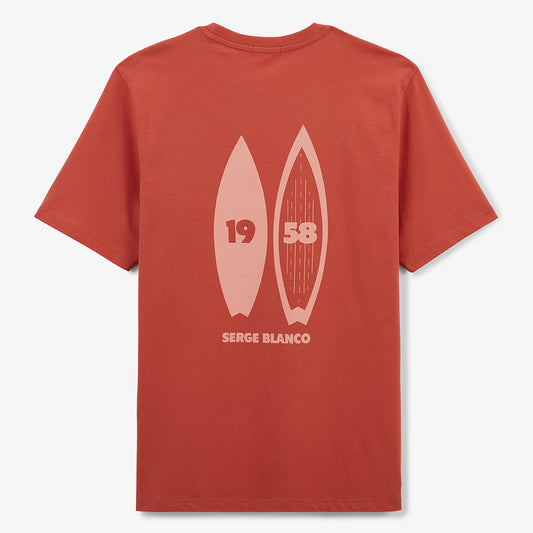 Men's round neck cotton T-shirt with rust orange surf print on the back by SERGE BLANCO