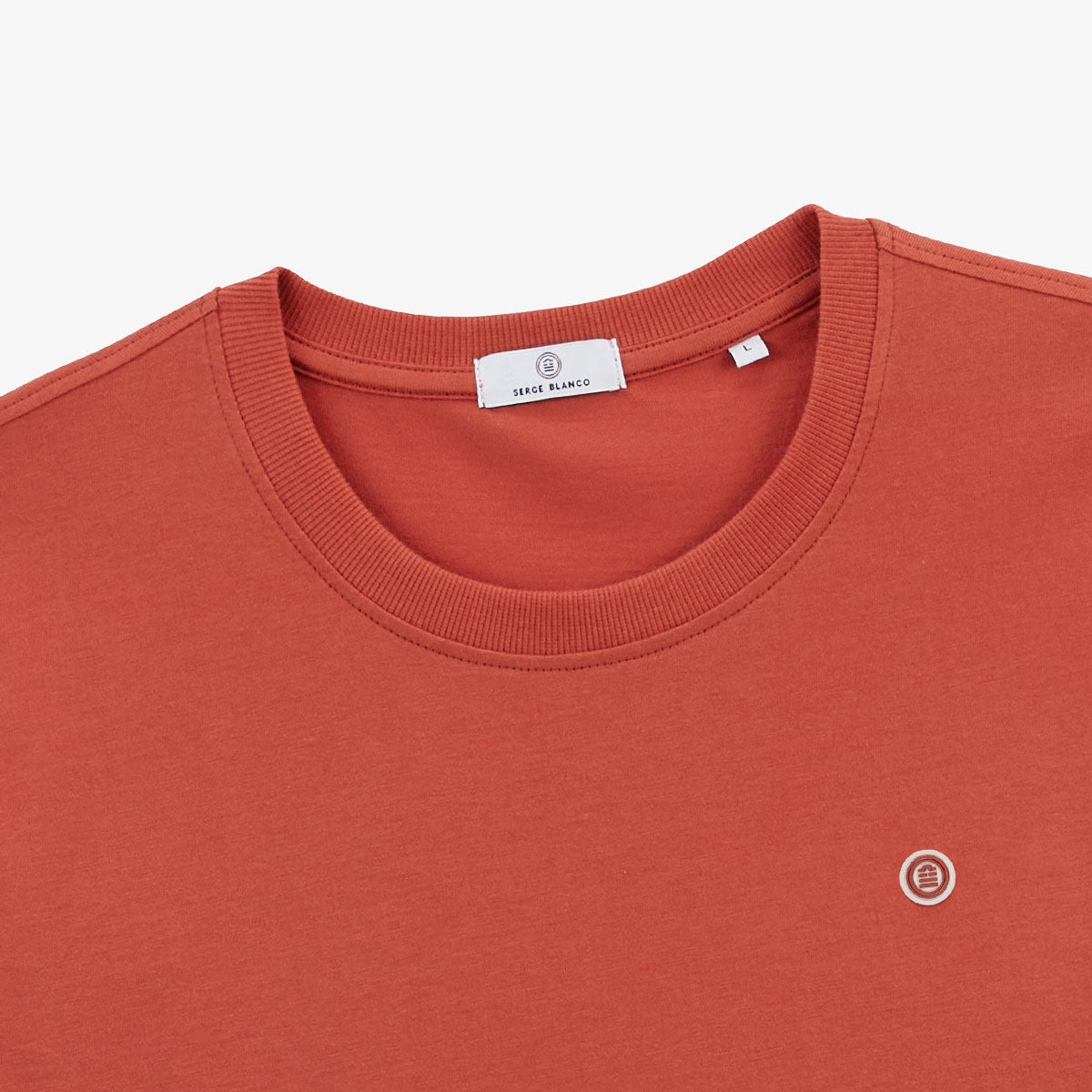 Men's round neck cotton T-shirt with rust orange surf print on the back by SERGE BLANCO