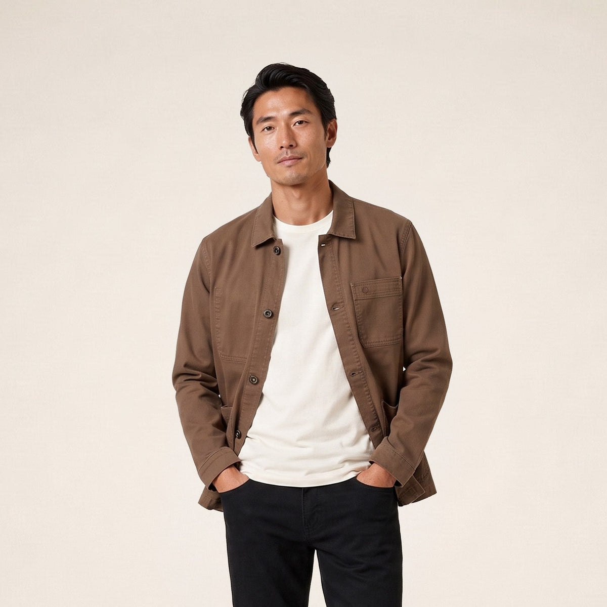 A brown cotton Wendel work jacket worn by a model, viewed from the front.