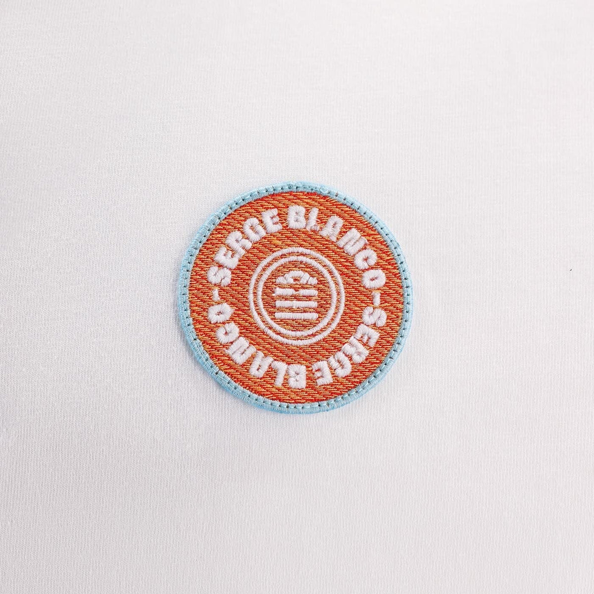 Léine polo bán le suaitheantas cófra